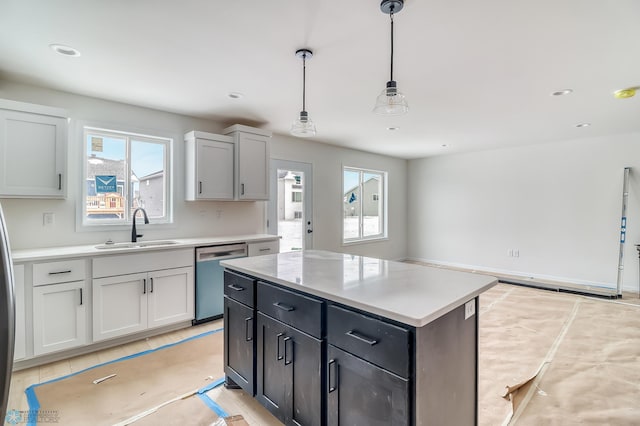 kitchen with light tile patterned flooring, dishwasher, sink, hanging light fixtures, and a center island