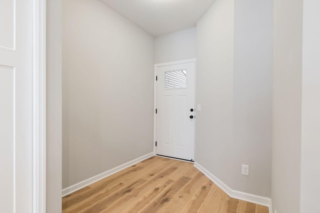 doorway with light wood-type flooring