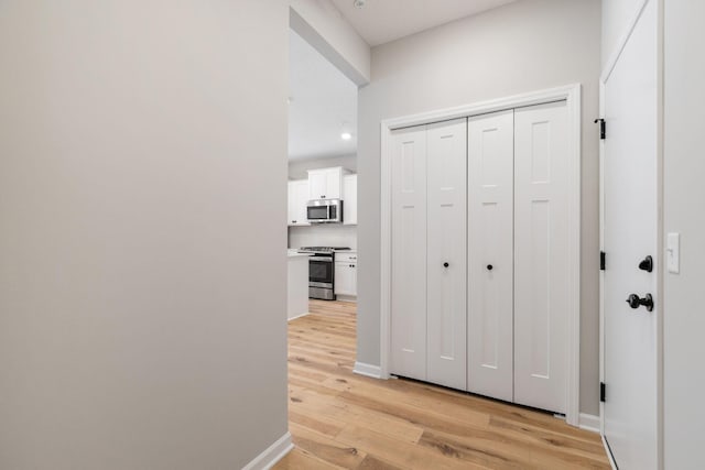 corridor featuring light hardwood / wood-style flooring