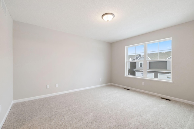 unfurnished room with carpet flooring