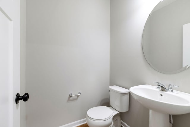 bathroom with sink and toilet