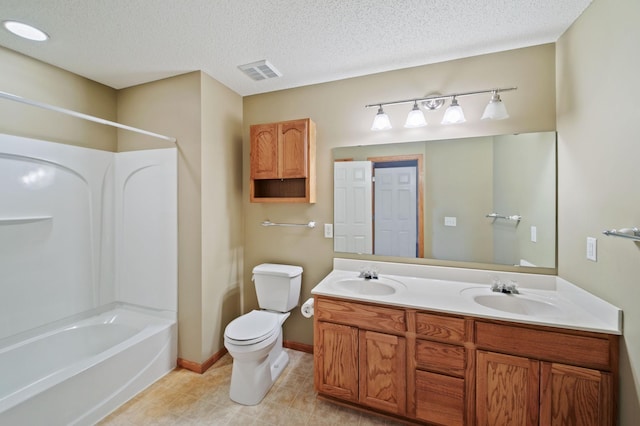 full bathroom featuring toilet, vanity, shower / washtub combination, and a textured ceiling