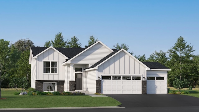 modern farmhouse featuring a front yard and a garage