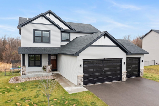 view of front of property featuring a front lawn and a trampoline