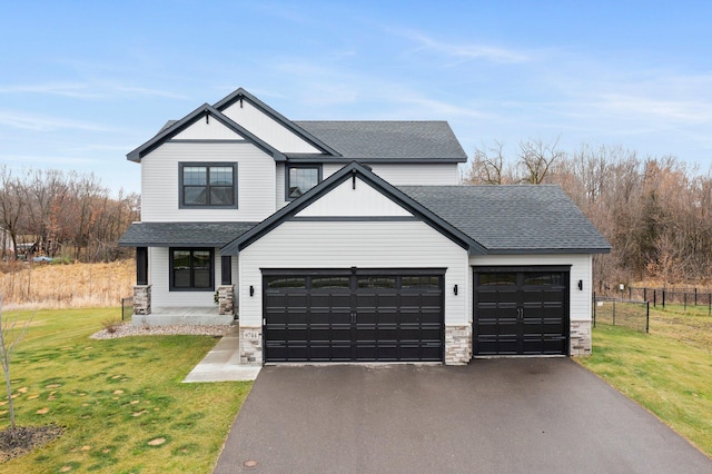 view of front facade featuring a garage and a front yard