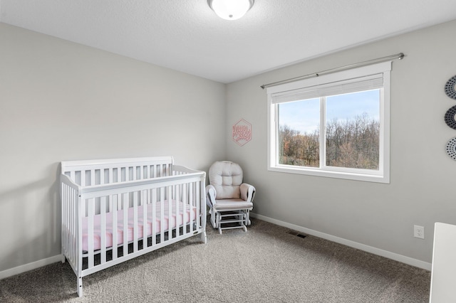 carpeted bedroom with a crib