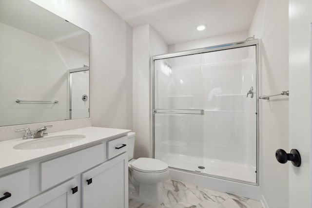 bathroom featuring walk in shower, vanity, toilet, and a textured ceiling