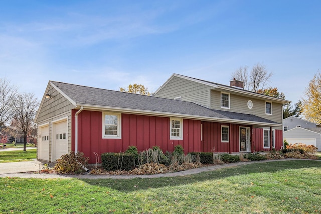 front of property featuring a garage and a front lawn