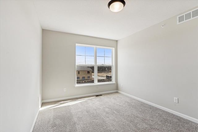 empty room featuring carpet flooring