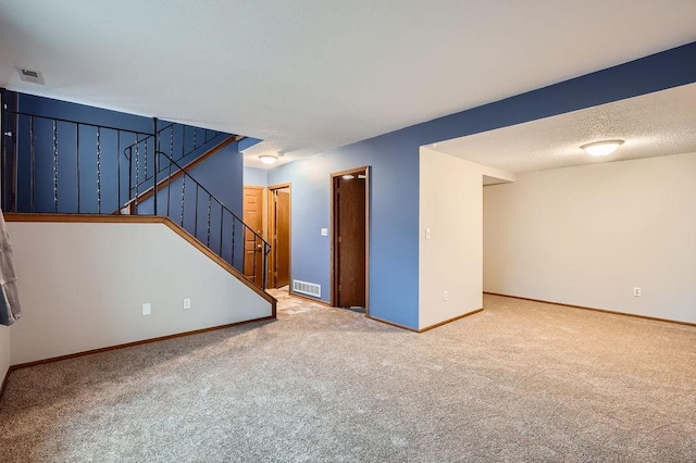 unfurnished living room featuring carpet