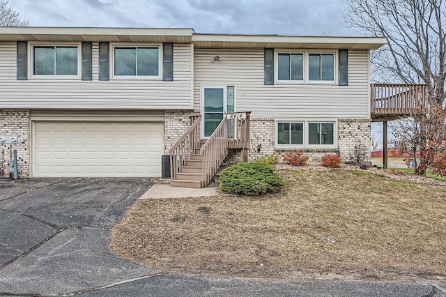 split foyer home featuring a garage