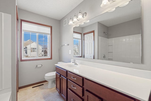 bathroom featuring a shower, a textured ceiling, toilet, and vanity