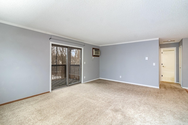 carpeted empty room featuring ornamental molding, a textured ceiling, and a wall unit AC