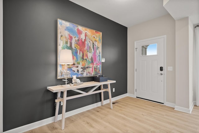 entryway with light hardwood / wood-style floors