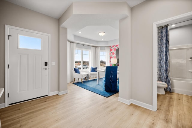 foyer entrance with light wood-type flooring