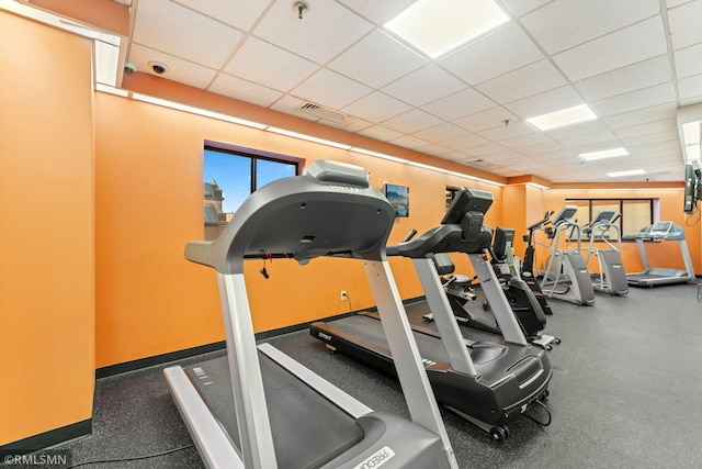 workout area with a drop ceiling