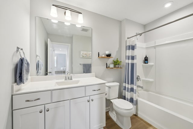 full bathroom with vanity, toilet, shower / bath combination with curtain, and hardwood / wood-style floors