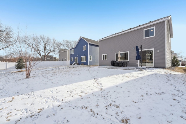 view of snow covered property