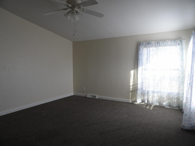 carpeted empty room featuring ceiling fan