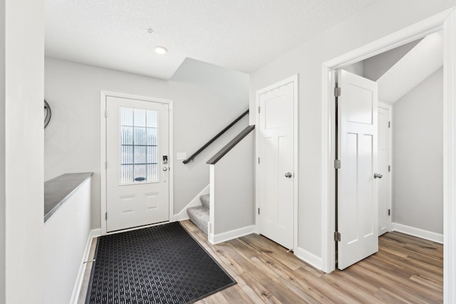 entryway with light hardwood / wood-style flooring