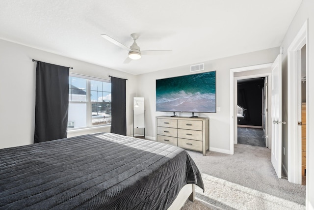 bedroom featuring ceiling fan and light colored carpet