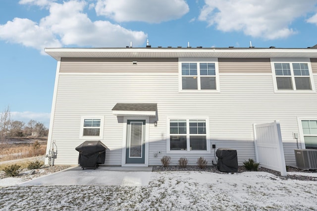 rear view of house featuring cooling unit