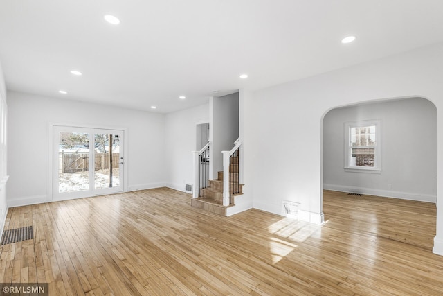 unfurnished living room featuring light hardwood / wood-style flooring