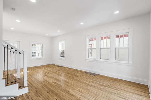 unfurnished room featuring light hardwood / wood-style flooring