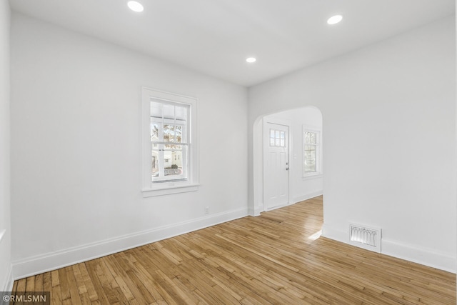 spare room with light wood-type flooring