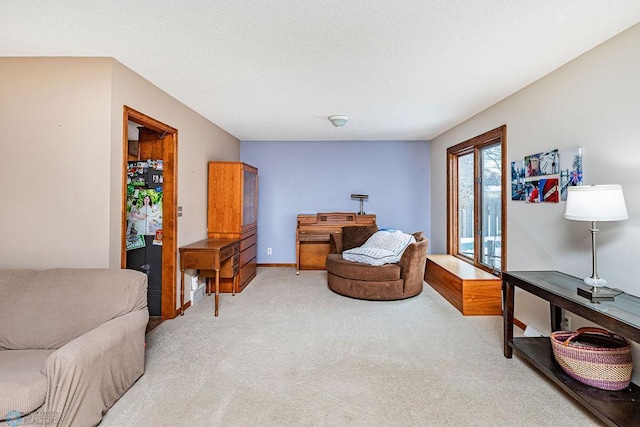 living area featuring light colored carpet