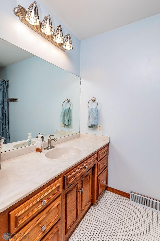 bathroom with vanity and tile patterned flooring