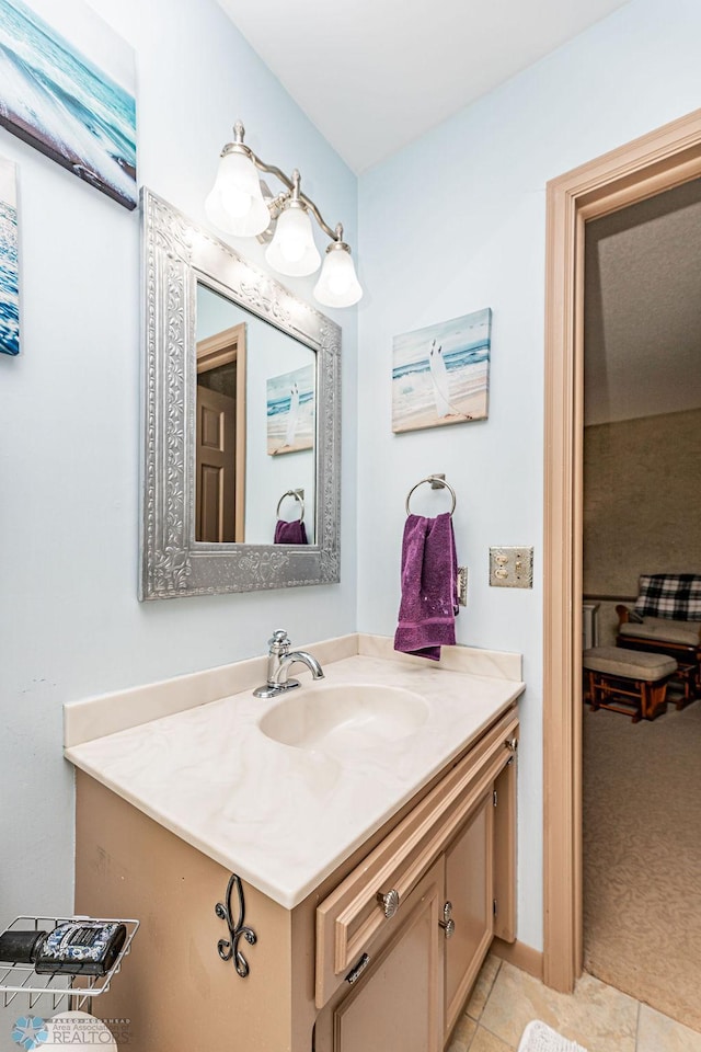 bathroom featuring tile patterned flooring and vanity