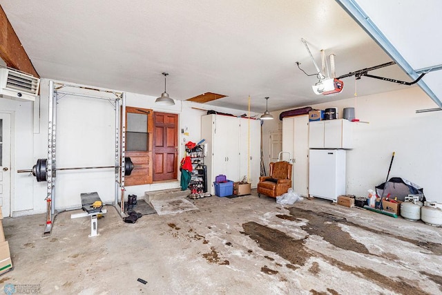 garage with white refrigerator and a garage door opener