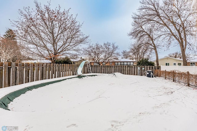 view of yard covered in snow