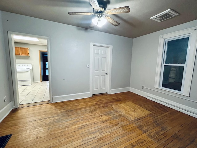 unfurnished room featuring ceiling fan and light hardwood / wood-style flooring