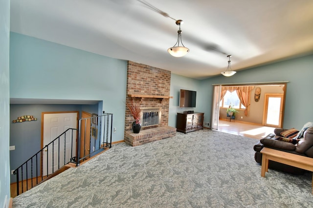 living room featuring carpet flooring, vaulted ceiling, and a brick fireplace