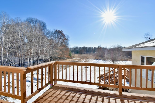 view of snow covered deck