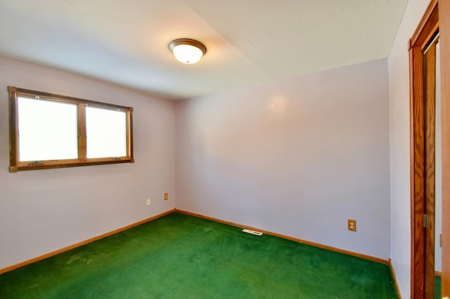 empty room with dark carpet