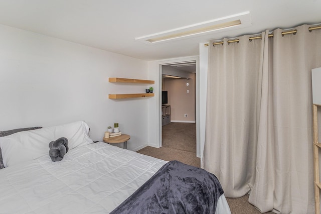 bedroom with carpet flooring and baseboards