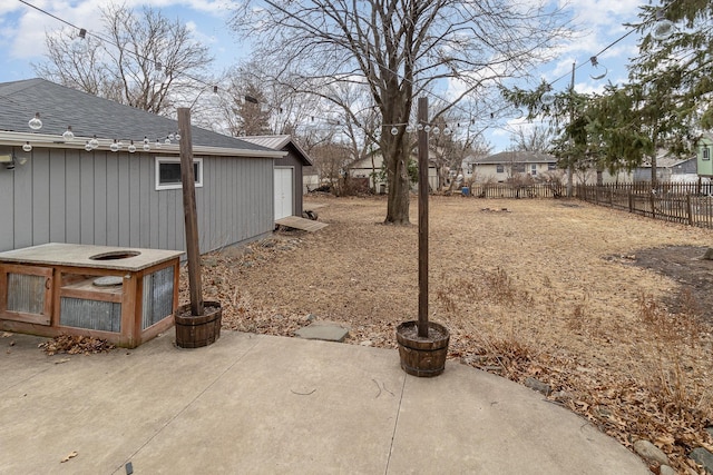 view of yard featuring a patio area and fence