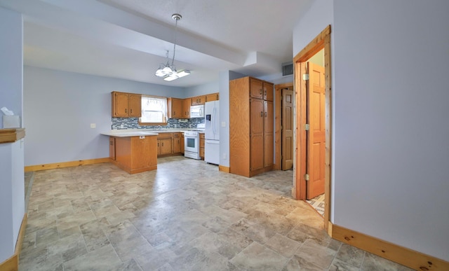 kitchen featuring light countertops, white appliances, backsplash, a peninsula, and brown cabinets