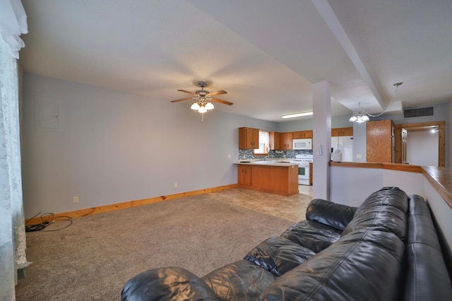 unfurnished living room with light colored carpet, visible vents, ceiling fan, and baseboards