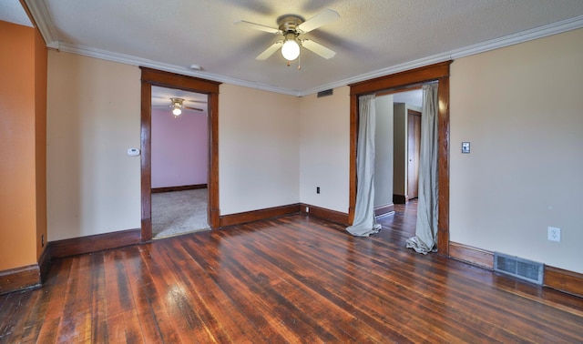 unfurnished room featuring ceiling fan, visible vents, and ornamental molding