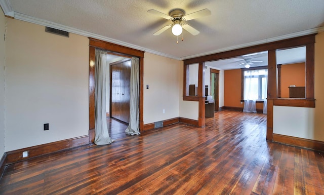 spare room with a textured ceiling, ceiling fan, crown molding, and wood-type flooring