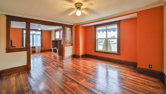 unfurnished room with baseboards, ceiling fan, hardwood / wood-style flooring, and a textured ceiling