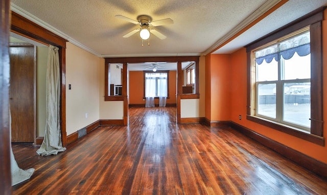 spare room with hardwood / wood-style floors, ceiling fan, baseboards, and crown molding