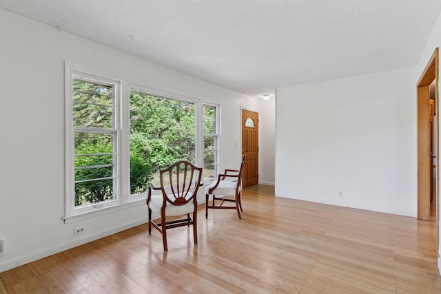 dining room with light wood-style flooring and baseboards