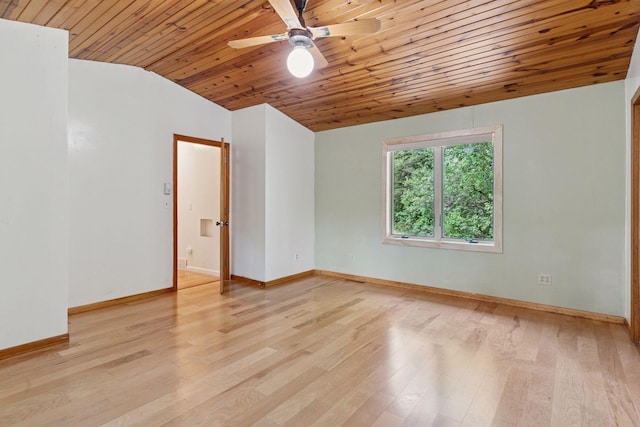 spare room with wooden ceiling, lofted ceiling, a ceiling fan, light wood-style flooring, and baseboards