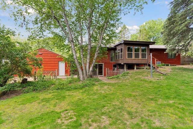 back of house featuring a sunroom