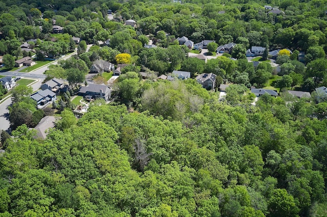 aerial perspective of suburban area with a heavily wooded area